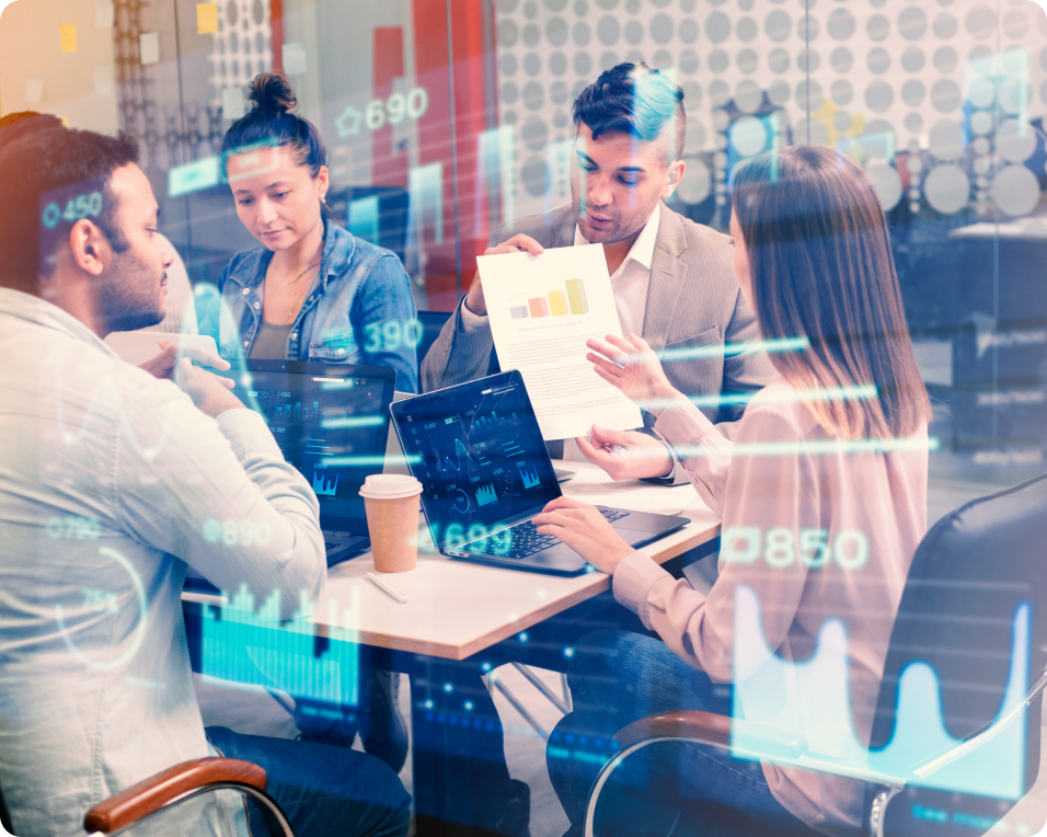 Genuity is proud to serve Chicago and the greater Chicago area with our years of IT expertise. We're here to work hard for you. Image of people at a conference table discussing business/IT analytics.
